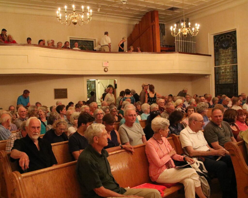 People gathered at a Charlemont Forum gathering.